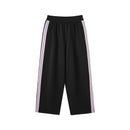 Black pants with white stripes on a white background