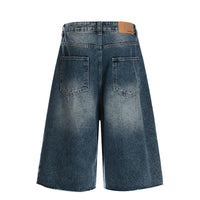 Blue denim shorts on a white background