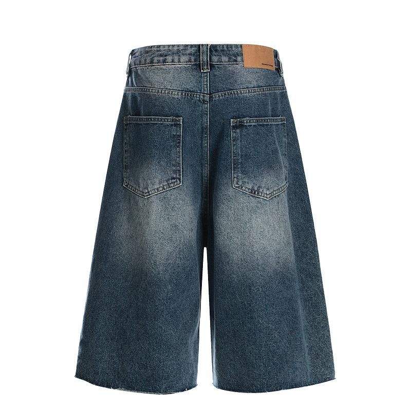Blue denim shorts on a white background