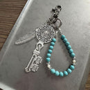 MYSTIC KEY AND FEATHER CHARM