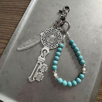 MYSTIC KEY AND FEATHER CHARM