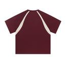 Maroon t-shirt with white accents on a white background